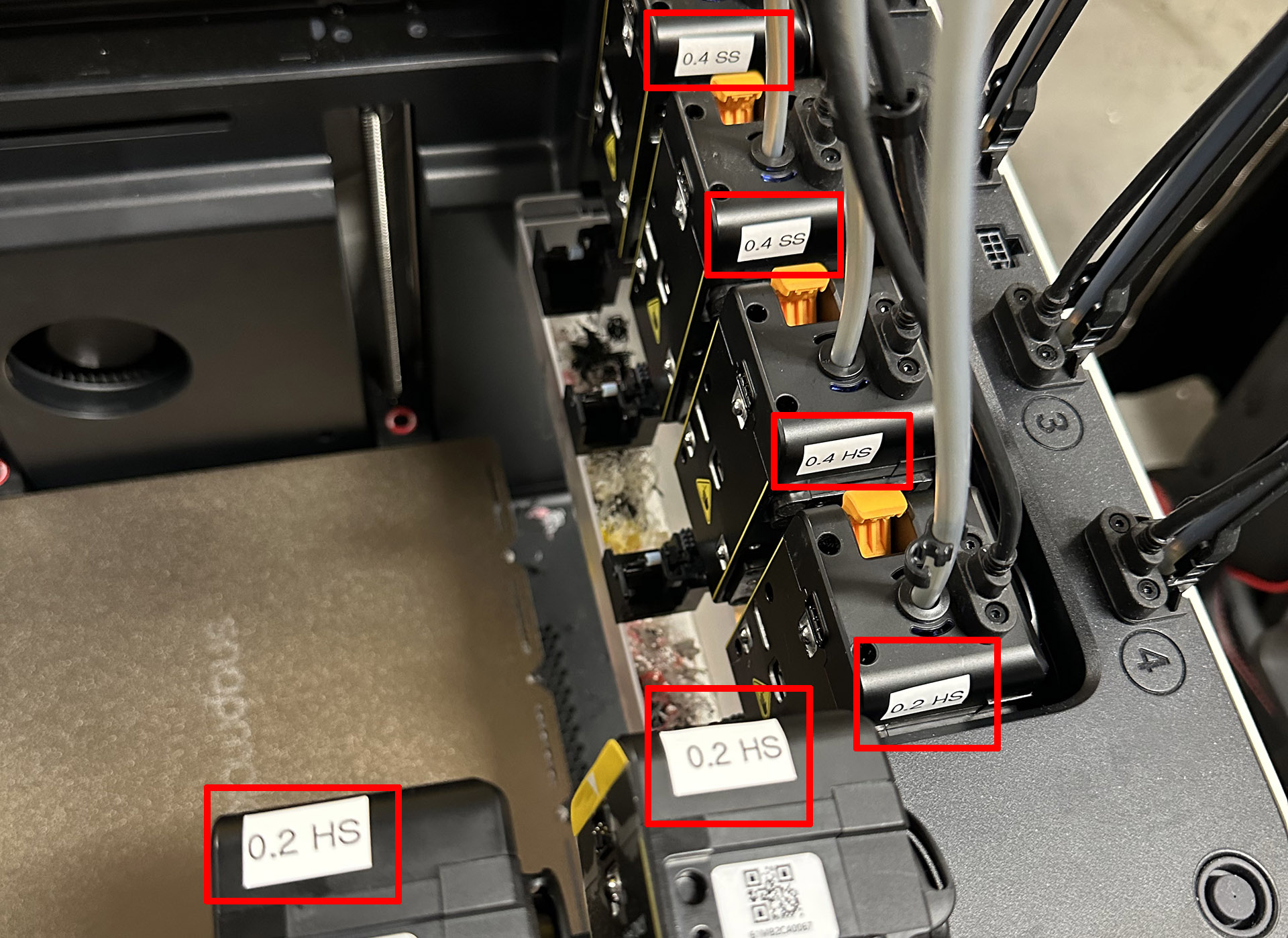 Label each toolhead with its nozzle diameter and material